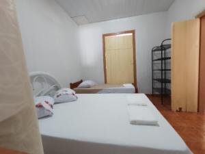 Ένα ή περισσότερα κρεβάτια σε δωμάτιο στο VILLA BOA Casa de Temporada