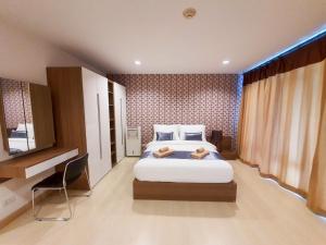 Ένα ή περισσότερα κρεβάτια σε δωμάτιο στο The Beach Bangsaen Condo 327-23 +14 φωτογραφίες