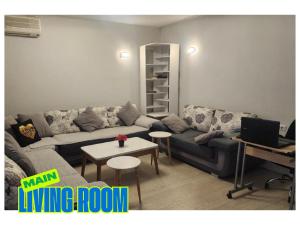 a living room with a couch and a table at TOPO Hostel in Tirana