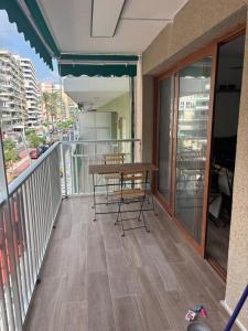 a balcony with a table and chairs on it at Brisa Marina in Cullera