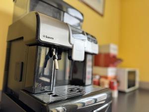 a coffee machine sitting on top of a counter at Family Hôtel in Wavre