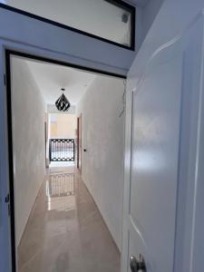 a hallway of a house with a glass door at Sunny apartment la huerta in Alicante