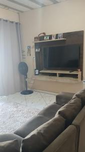 Televisyen dan/atau pusat hiburan di Casa Praia Grauçá +4 gambar
