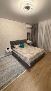 Postel nebo postele na pokoji v ubytování Люкс апартамент ЦЕНТР