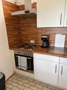 Nhà bếp/bếp nhỏ tại Ferienwohnung -Freundeskreis- im Taunusblick für bis zu 8 Personen - A402