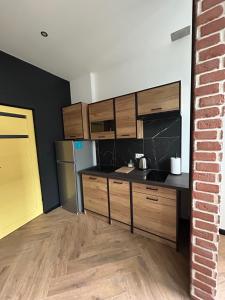 Kuchyň nebo kuchyňský kout v ubytování La Ville - Jaune