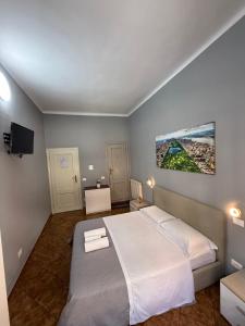 Postel nebo postele na pokoji v ubytování Crown Guest House