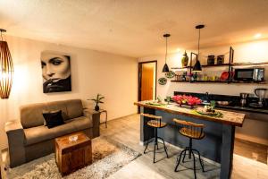 a living room with a couch and a table at Apartamento Villa Siena Condomínio À Beira Mar próximo ao Aeroporto in Salvador