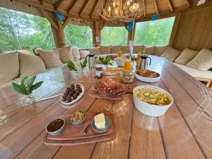 a table with many plates of food on it at Gite De La Borie in Saint-Ignat