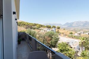 a balcony with a view of the mountains at Villa Merkaj in Sarandë
