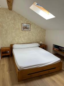 a bedroom with a bed with a white mattress at Gîte montagnard plateau de Beille in Les Cabannes
