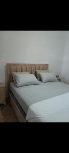 a large white bed with white sheets and pillows at Résidence de luxe cabo dream 2 chambre salon in Cabo Negro +18 photos