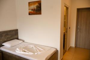 Postel nebo postele na pokoji v ubytování Mucobega Hotel 2