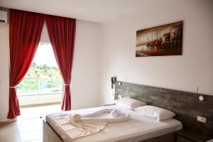 Postel nebo postele na pokoji v ubytování Mucobega Hotel 2