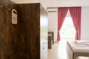 Postel nebo postele na pokoji v ubytování Mucobega Hotel 2