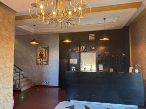 a chandelier is hanging in a room with a counter at Hotel Iliria in Orllan