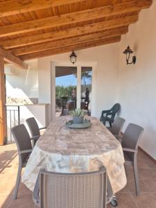 a dining room with a table and chairs at Villa Margherita in Terrasini
