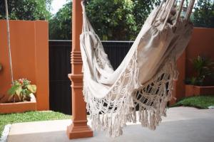 a hammock hanging from a pole in a yard at Bakamuna Villa in Dickwella +31 photos