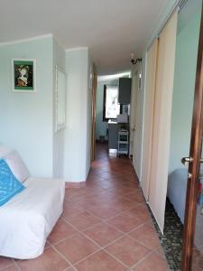 a room with a bed and a tiled floor at New! La Ginestra,casa vacanze bifamiliare in montagna-Seulo Sardegna in Seùlo +48 photos