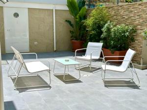 a group of chairs and a table on a patio at Casa Genzino in Molfetta