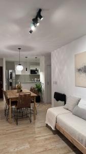 a bedroom with a dining room table and a bed at Departamento en Rojas in Rojas