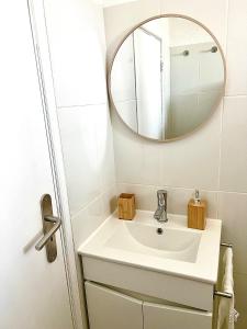 a bathroom with a sink and a mirror at Refúgio do Bugalho - Casa da Oliveira in Alandroal +13 photos