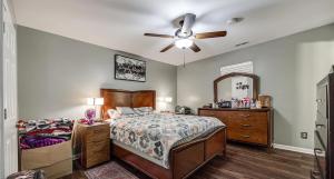 a bedroom with a bed and a ceiling fan at Cozy hill in Rock Hill