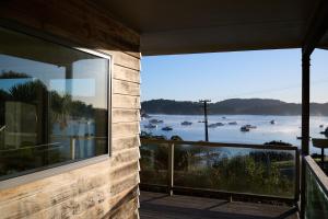 a balcony with a view of a body of water at Greenvale Bed and Breakfast in Oban