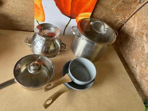a group of pots and pans on a counter at WithamCamp in Wanstrow