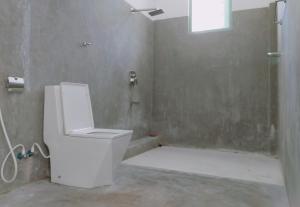 a bathroom with a toilet and a shower at Mangroven River View Hotel in Bentota +12 photos