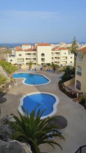 a view of a swimming pool in a resort at the green holes in San Miguel de Abona