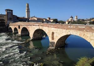 a bridge over a river in a city at Civico138 in Verona