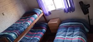 Postel nebo postele na pokoji v ubytování Casa Los colibrí