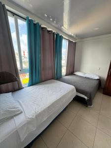 Ένα ή περισσότερα κρεβάτια σε δωμάτιο στο Ocean Tours san Andrés