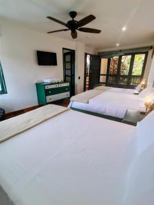 Postel nebo postele na pokoji v ubytování Casa Silva - Hotel Cafe