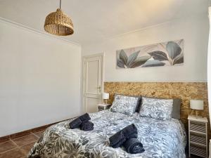 a bedroom with a bed with two pillows on it at Villa Morriña by Vulcano Homes in Playa Honda