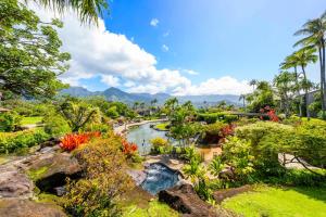 a view of a garden with a river at Ocean and Mountain Views Hanalei Bay Resort in Princeville