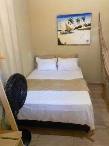 a bedroom with a bed in a room at Casa em Praia de Flecheiras in Trairi