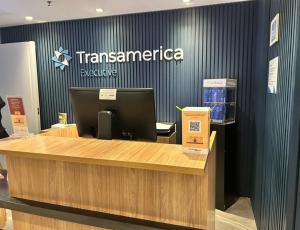 a ticket counter at atransamerica booth with a computer at Flat Transamerica4 bela cintra com estacionamento in Sao Paulo +31 photos