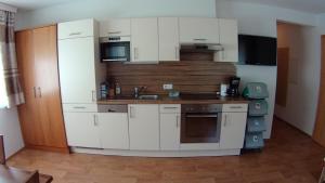 Kuchnia lub aneks kuchenny w obiekcie Apart Alexandra