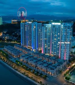 an aerial view of a city at night with a ferris wheel at Homestay 2pn Sapphire in Ha Long