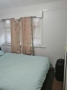 Postel nebo postele na pokoji v ubytování Cheerful home