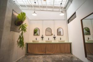 a bathroom with three sinks in a room at Carnarvon 73 in George Town +27 photos
