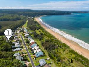 an aerial view of a beach with a group of houses at The Sandcastle in Long Beach