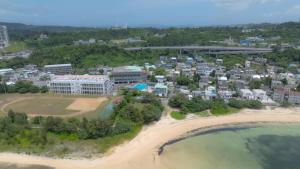 an aerial view of a resort on the beach at 恩納村仲泊海の見える2LDkアパート in Onna