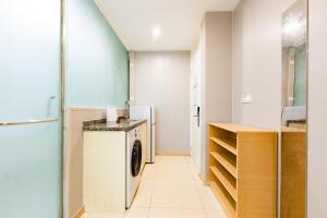a laundry room with a washer and dryer at Shanghai Koala International Youth Hostel in Shanghai