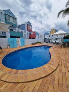 a swimming pool in front of a house at 9 By the Clyde, Central Location in Batemans Bay in Batemans Bay