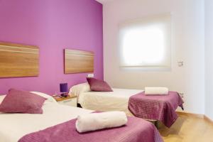 Postel nebo postele na pokoji v ubytování Apartamentos Tito San Agustin