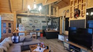 TV a/nebo společenská místnost v ubytování Cabaña "Sur Patagonico"