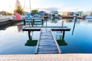 a dock on a body of water with boats at Aqua Tides - Port Geographe in Geographe